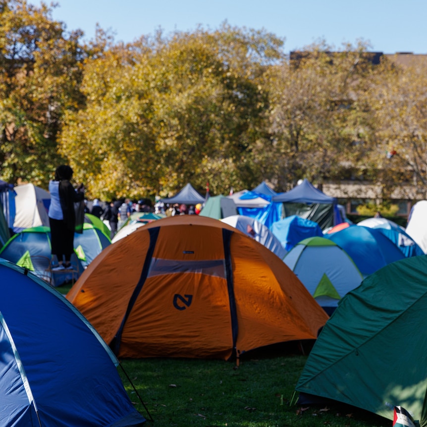 Several tents set up at Melbourne University ground. 