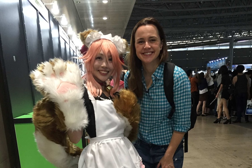 Rachel Mealey next to a gaming fan dressed in costume