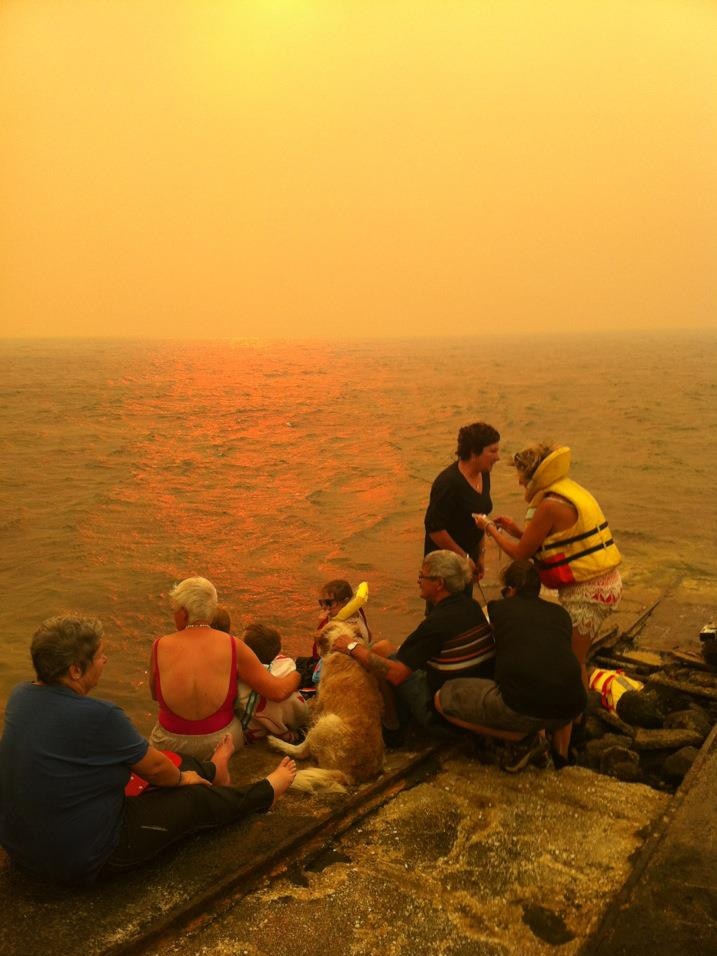 Locals shelter from the bushfire at Murdunna.