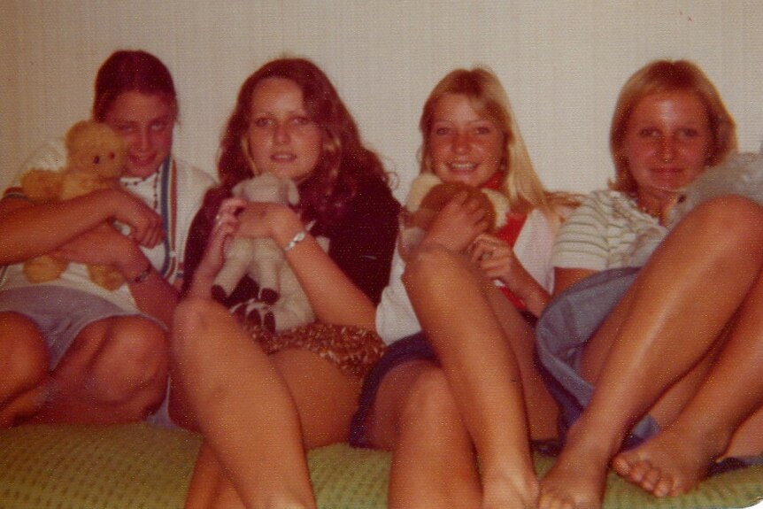 A photo of Trudie Adams and her friends sitting on a couch