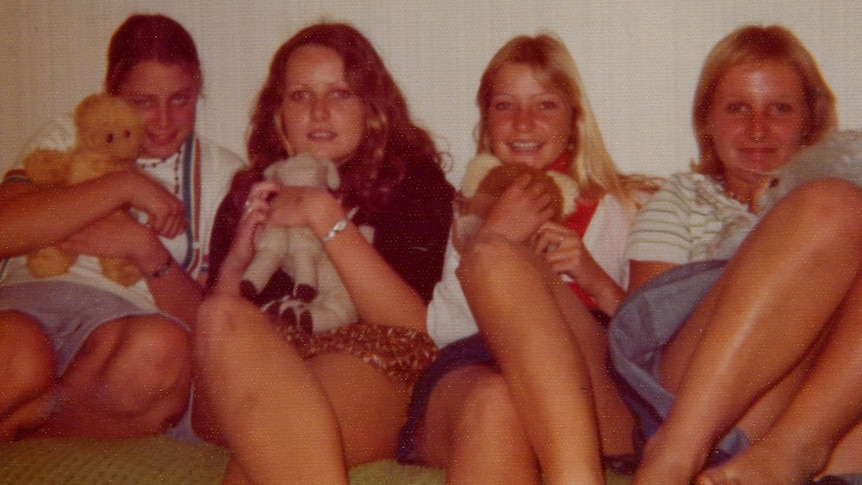 A photo of Trudie Adams and her friends sitting on a couch