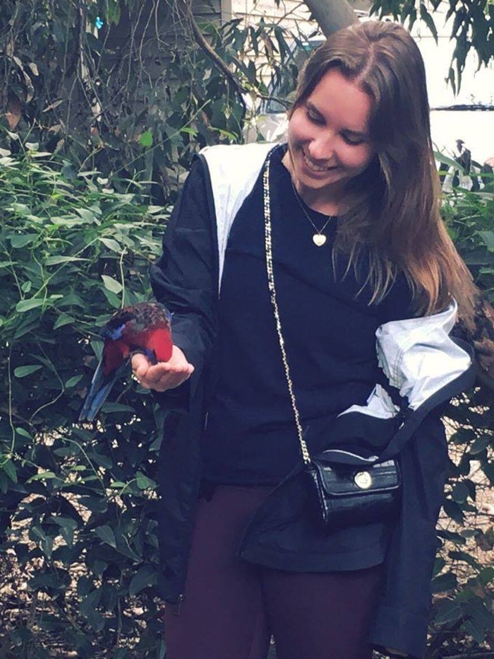 Tracey feeding a bird.