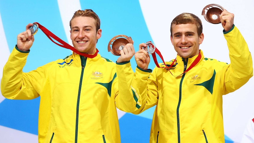Australian silver medallists Matthew Mitcham (L) and Grant Nel after the men's 3m synchro diving.