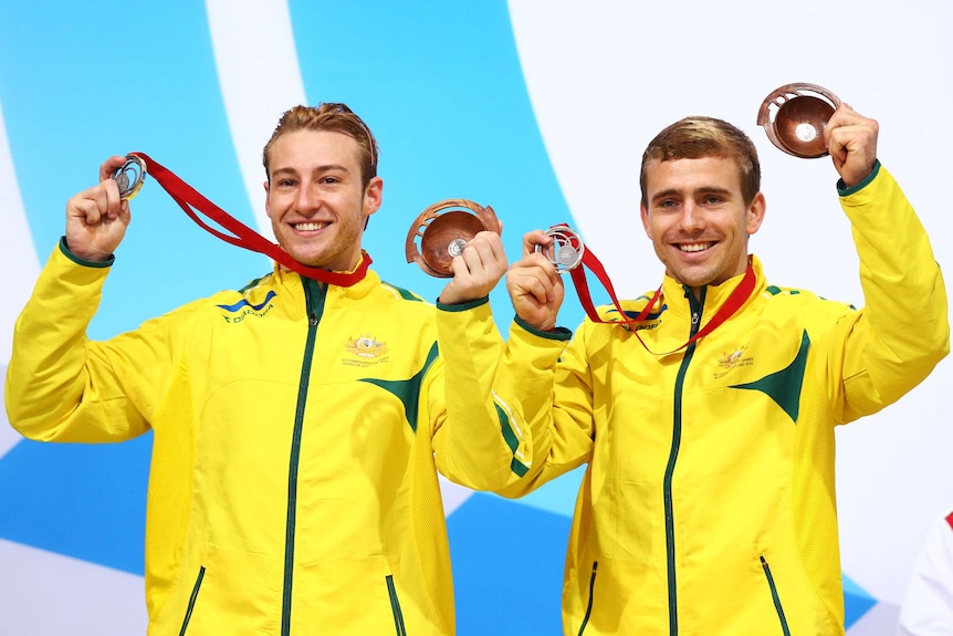 Australian silver medallists Matthew Mitcham (L) and Grant Nel after the men's 3m synchro diving.