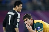 So close: Star forward Harry Kewell rues one of several missed chances in a game Australia perhaps should have won.