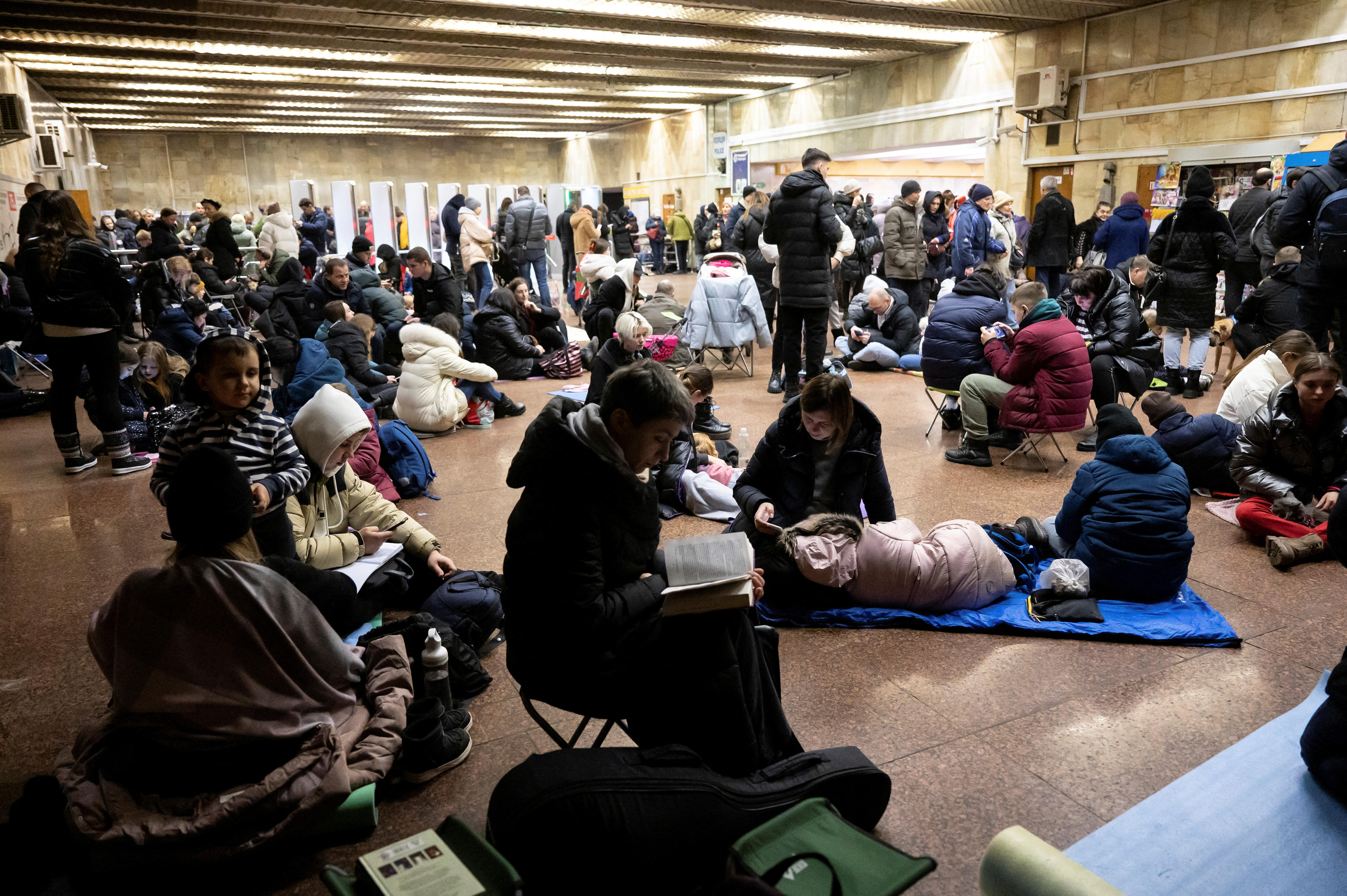 People take shelter at a Kyiv metro station during a Russian air raid.