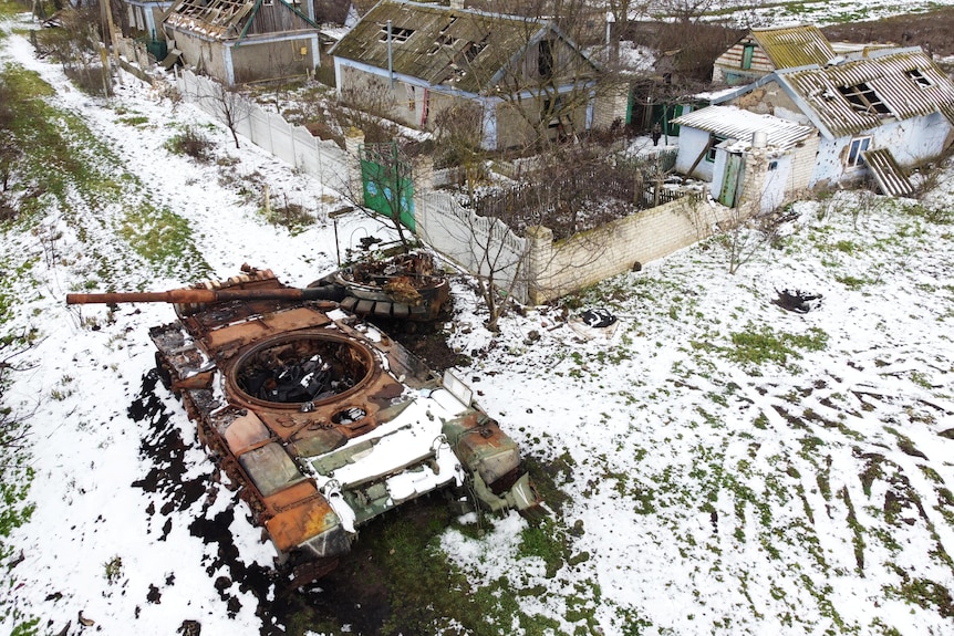 A large tank outside in the snow. 