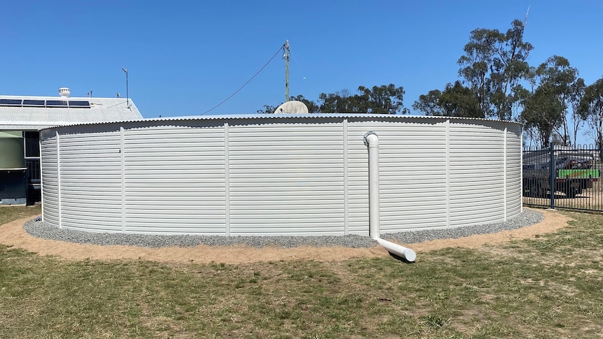 A huge water tank in a dry area.