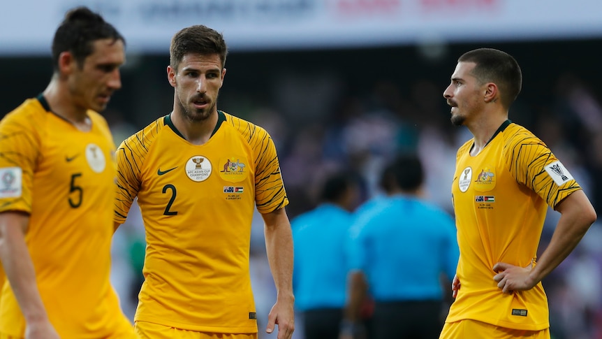 Socceroos players Mark Milligan, Milos Degenek and Jamie Maclaren look forlorn after losing to Jordan