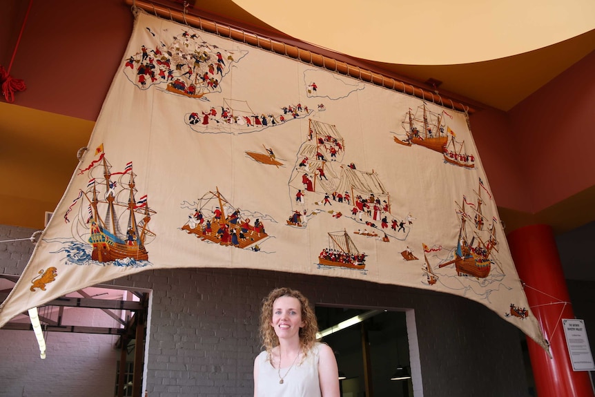 Melinda Piesse and her Batavia tapestry.