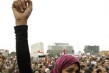 A protester holds back her tears as she chants anti-government slogans during demonstrations in Egyp