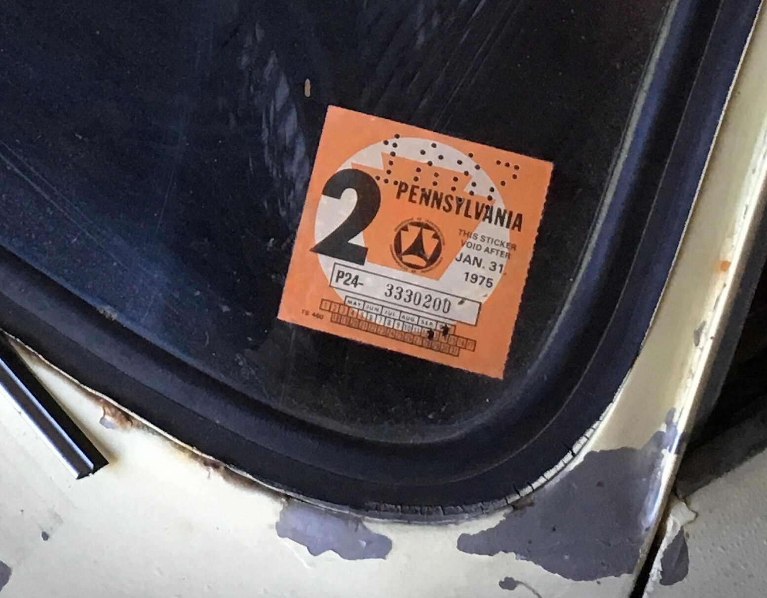 The registration sticker, expiring January 31, 1975.