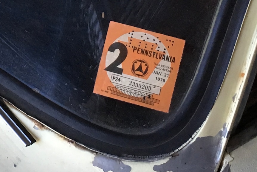 The registration sticker, expiring January 31, 1975.