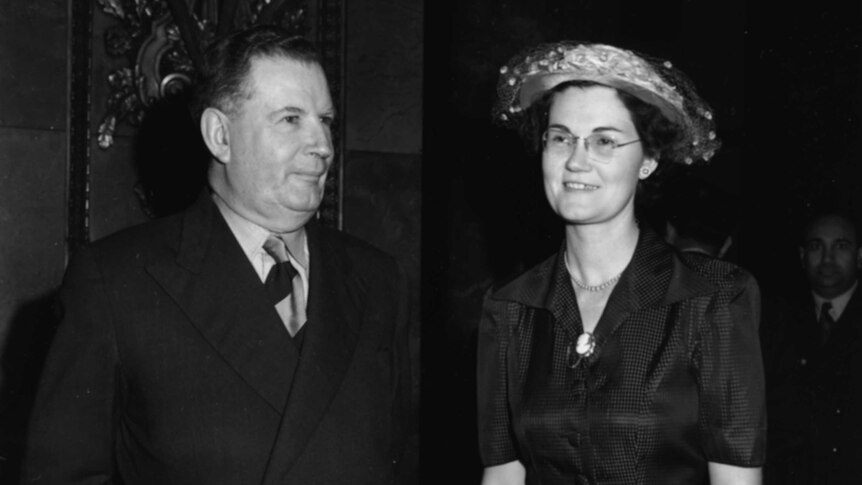 A black and white image of Sir Arthur Fadden with his daughter in 1952. Both are dressed in formal wear.