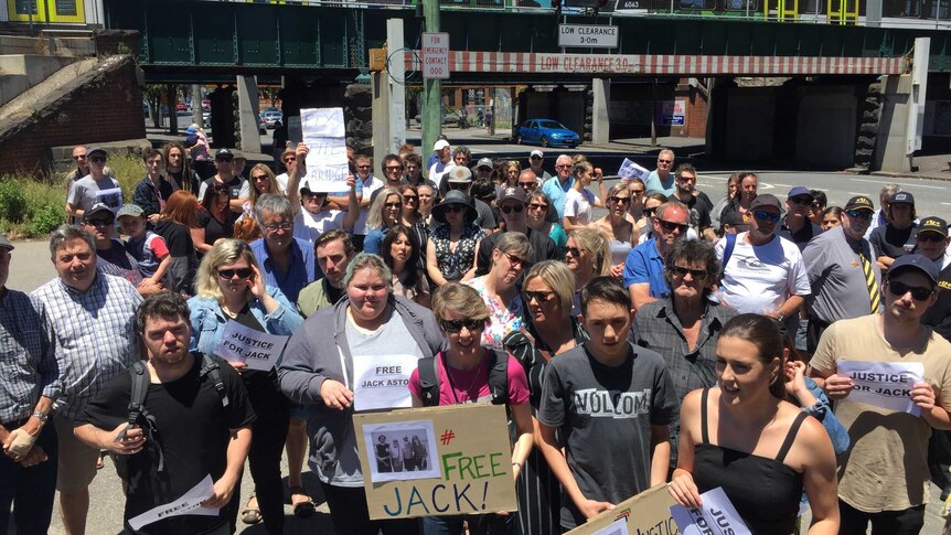 Supporters of Jack Aston hold up signs saying Justice 4 Jack.