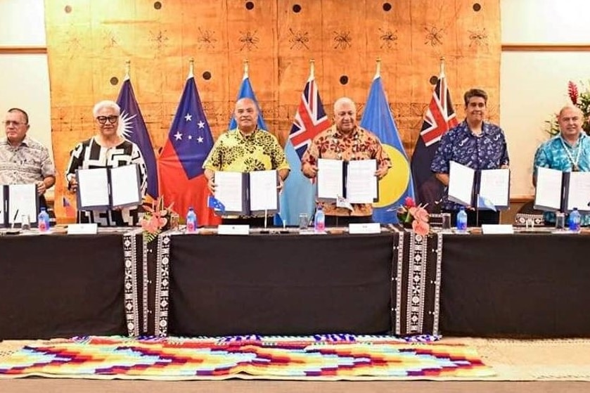 Pacific leaders hold up an agreement