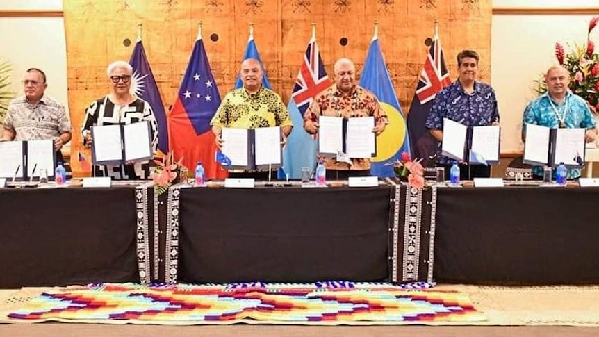 Pacific leaders hold up an agreement