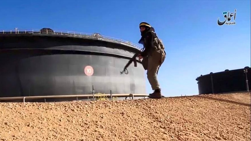 IS fighter at Es Sider oil storage tank