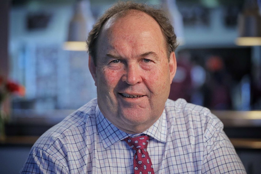 A man wears a shirt and tie.