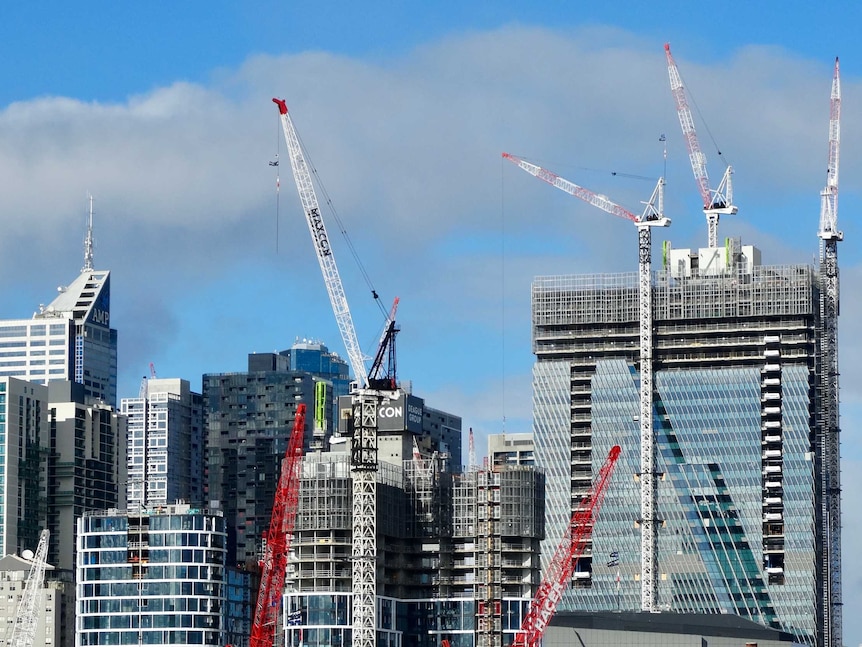 Cranes on Melbourne buildings seen from West Melbourne.