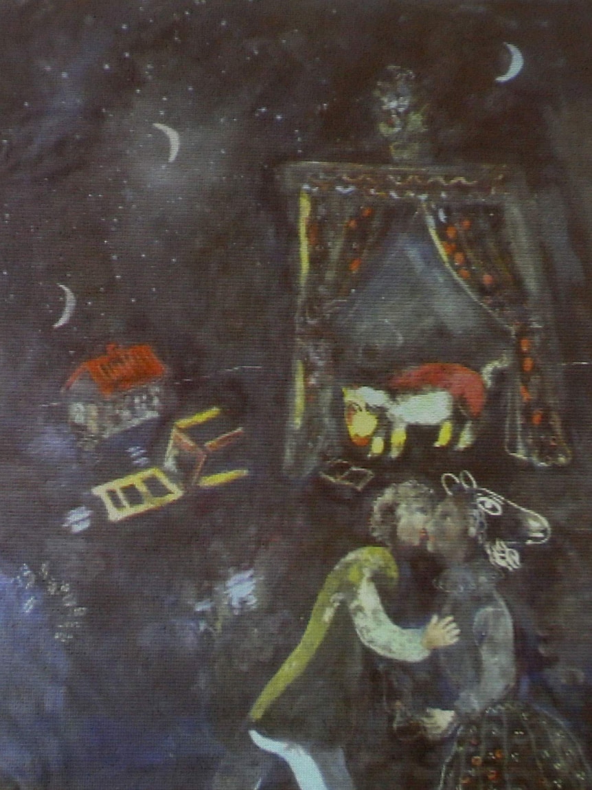 A formerly unknown painting of French artist Marc Chagall is beamed to a wall during a news conference.