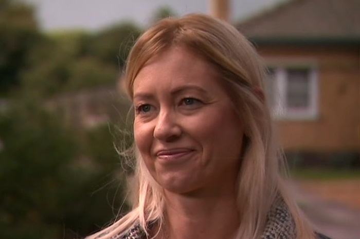 Sheree Reynolds smiling while standing outside.