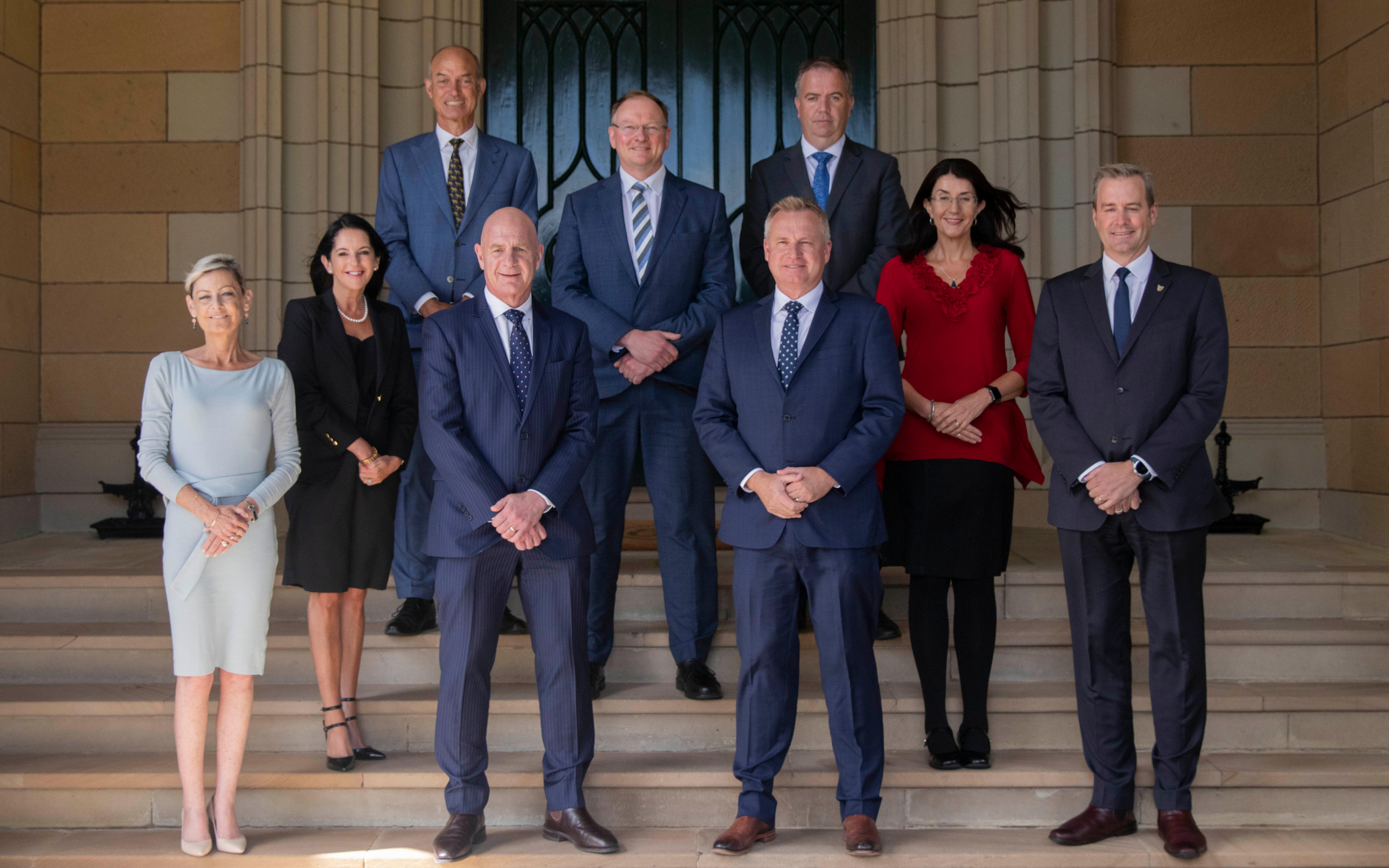 Group of politicians standing on the steps