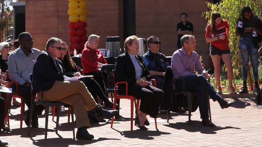 a group sitting listening