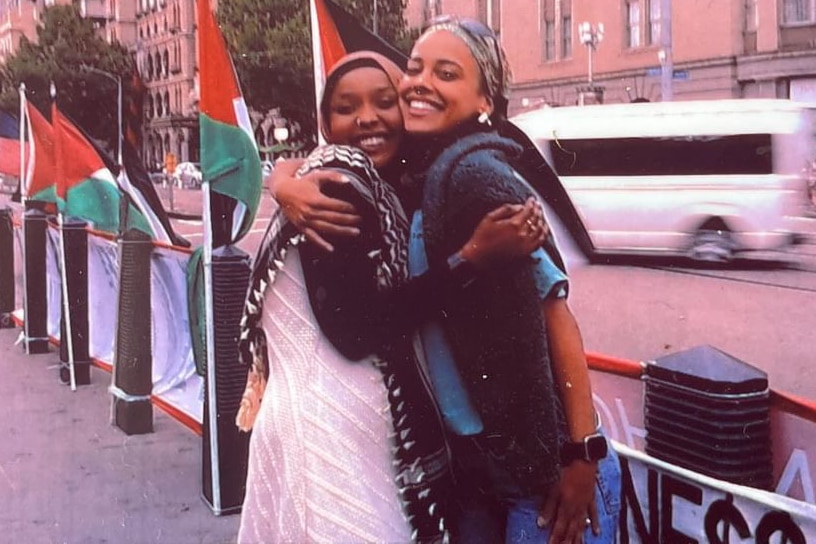 A photo of Shakya with her friend (right). They are both hugging.