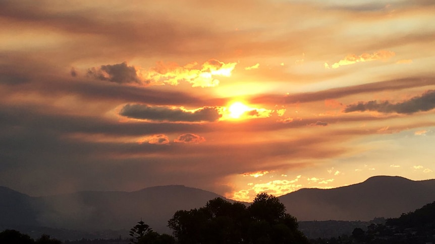 Sunset over Hobart after fuel reduction burn