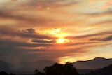 Sunset over Hobart after fuel reduction burn