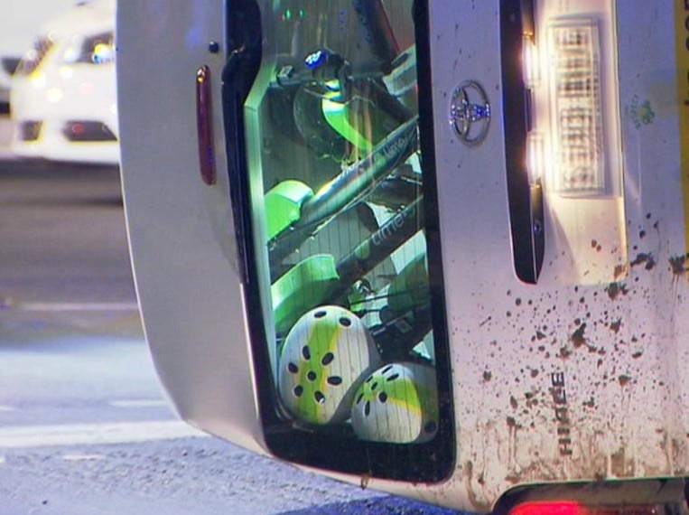 Electric scooters in the back of a van that has rolled over