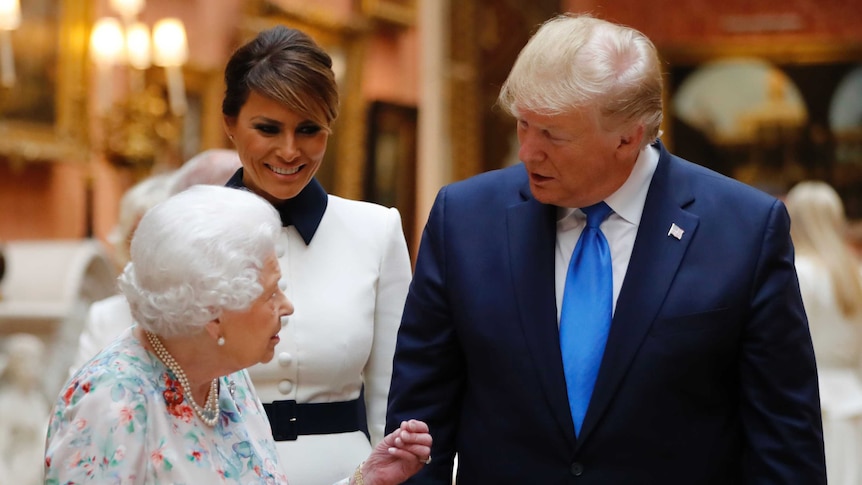 Britain's Queen Elizabeth speaks to US President Donald Trump and First Lady Melania Trump