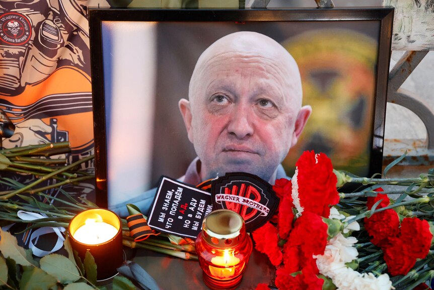 A view shows a portrait of Wagner mercenary chief Yevgeny Prigozhin at a makeshift memorial.