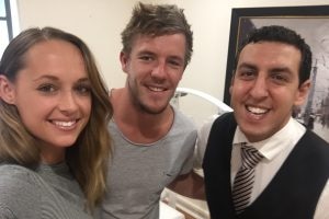 A woman and Luke Parker smile in a photo with Ramy Georgy.