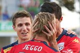 Adelaide United celebrate James Jeggo's goal