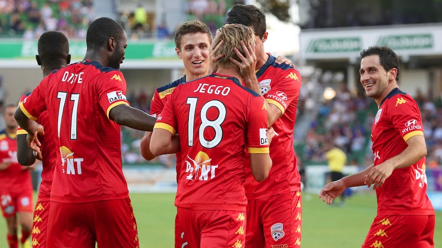 Adelaide United celebrate James Jeggo's goal