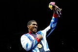 Joshua celebrates with Olympic gold