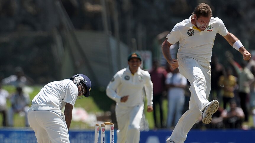 Ryan Harris (R) skittled the Sri Lankans with a five-wicket haul which included the vital wicket of centurion Mahela Jayawardene.