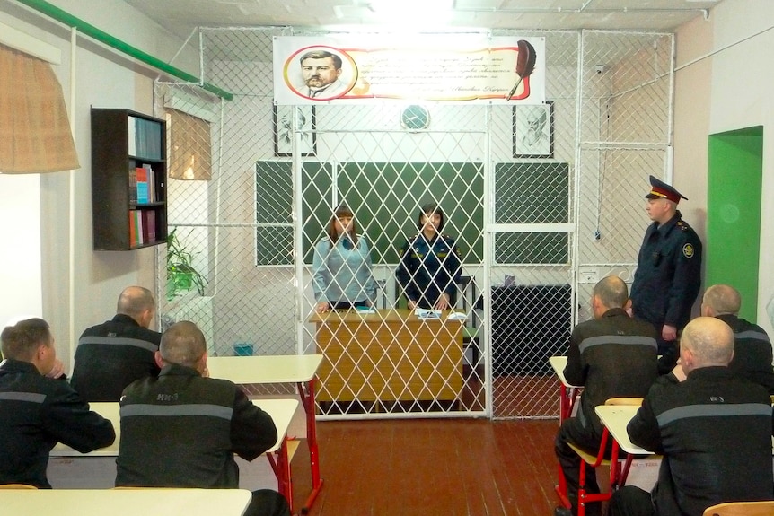 Prisoner at a Russian penal colony sit in a classroom.