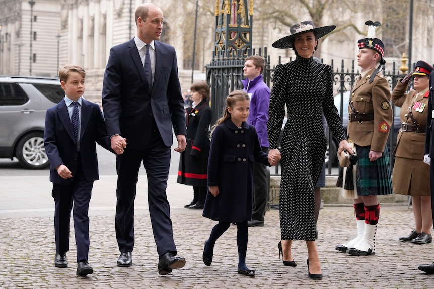 Prince William and Catherine, in formal attire, walk with children George and Charlotte at Prince Philip's thanksgiving service.
