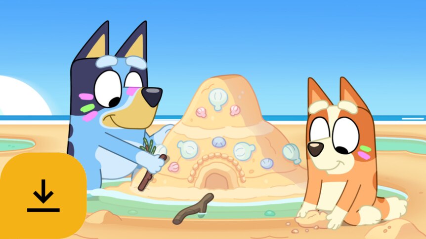 Bluey and Bingo make a sandcastle at the beach