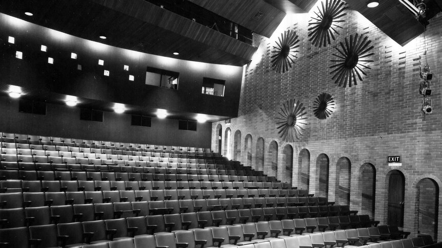 A black and white photo of the inside of a theatre.