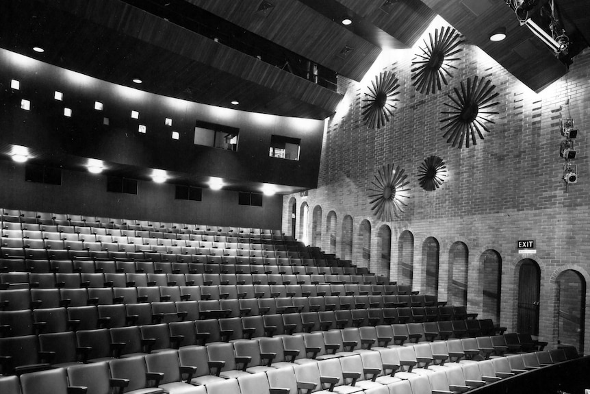 A black and white photo of the inside of a theatre.