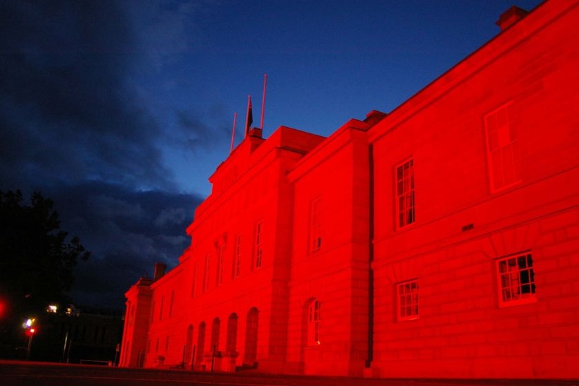 Parliament House in Hobart is bathed in red light for Remembrance Day