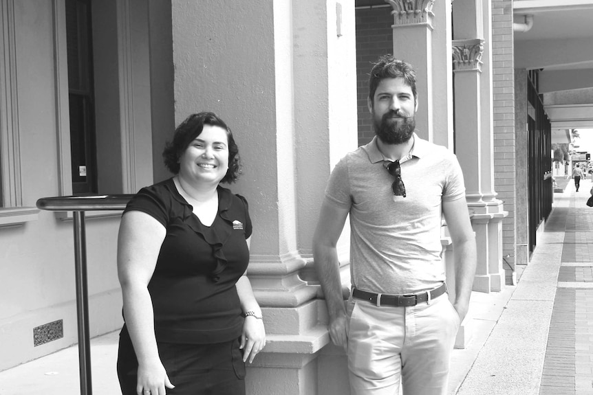 Black and white photo of two people standing in the main street of Bundaberg
