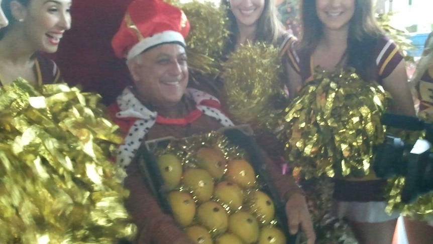 Greengrocer Sam Coco was crowned 'mango king' with a bid of $76,000.
