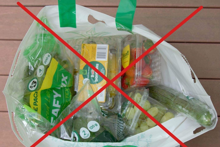 Plastic wrapped groceries with a big red cross over them.