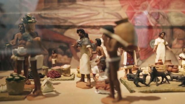 A diorama shows Aztec figurines