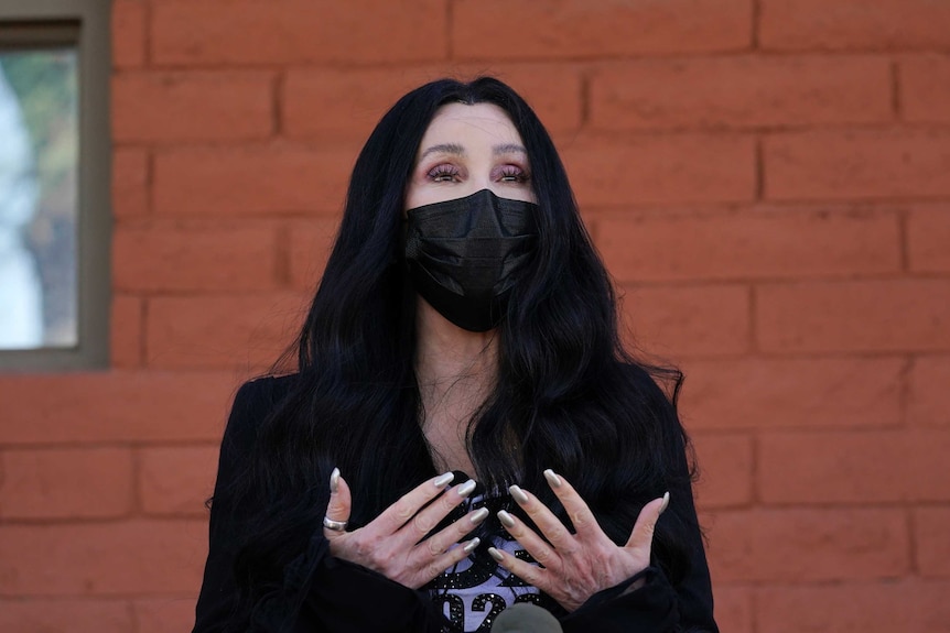 Cher gestures as speaks while campaigning for Joe Biden